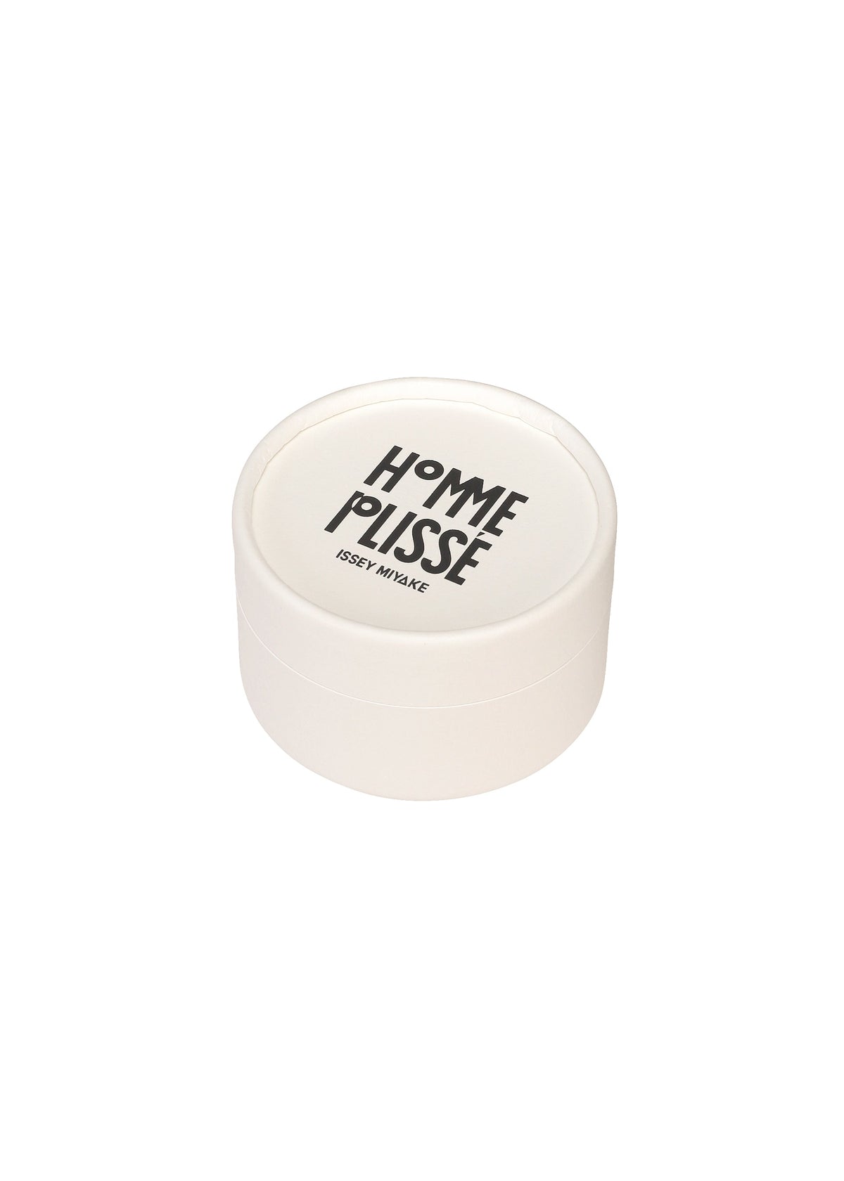 Zoomed view A round white container with a lid displaying HOMME PLISSÉ ISSEY MIYAKE in black, inspired by the modern style of the IN THE SHADOW PLEATS TIE, set against a plain white background.