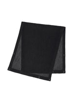 The RUSTIC MESH STOLE by HOMME PLISSÉ ISSEY MIYAKE is a black, rectangular, pleated accessory featuring ribbed fabric and metal grommets along the edges, shown folded against a white background. - BLACK （no.15）