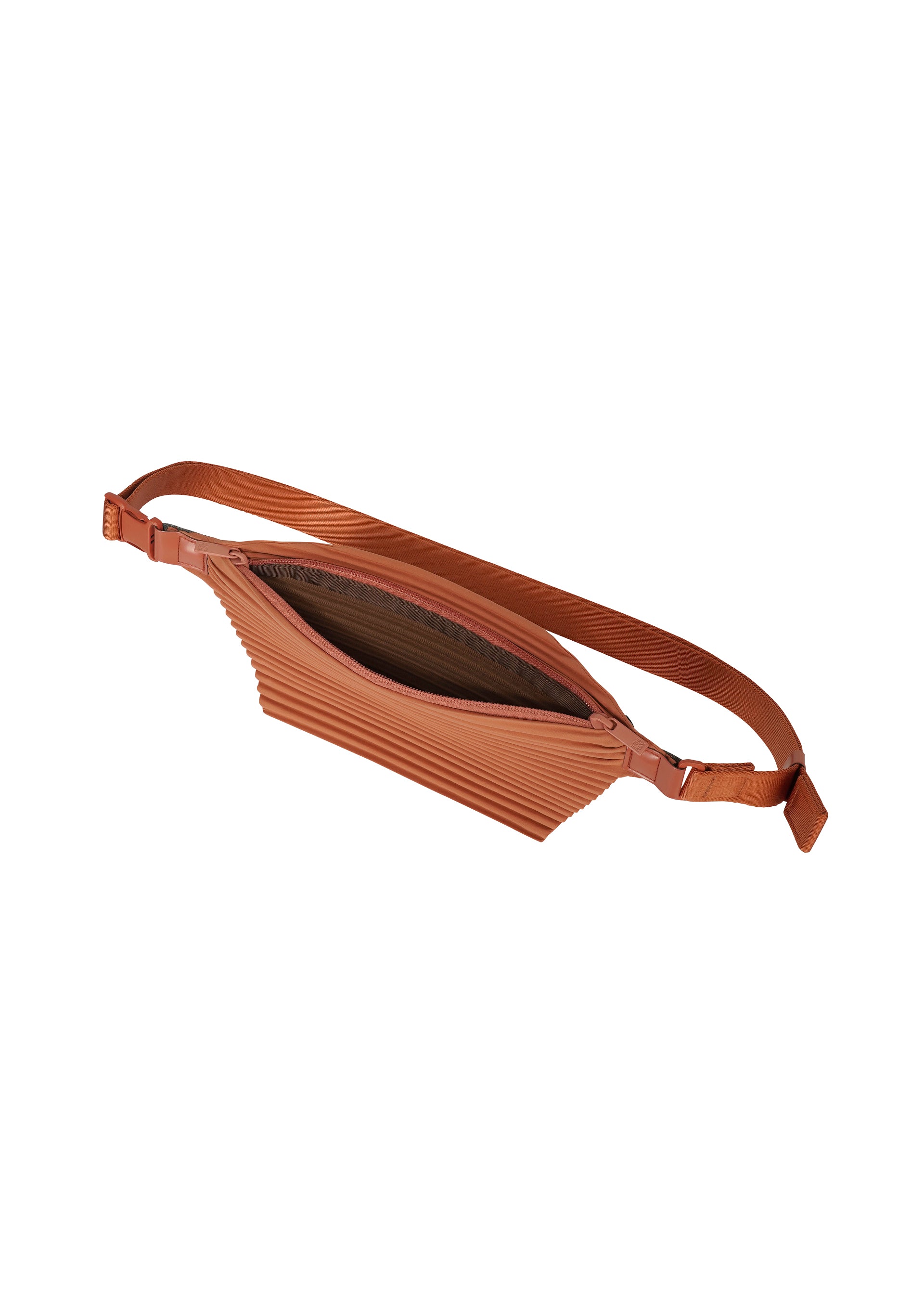Zoomed view The PLEATS SLIM BAG by HOMME PLISSÉ ISSEY MIYAKE is a brown pleated belt bag with an adjustable strap and a zippered opening, shown from above with the main compartment partially open to reveal a dark interior lining. This minimalist accessory features a versatile two-way design, allowing it to be styled as a small shoulder bag.