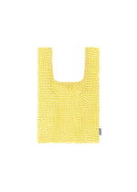 A small, rectangular MESH PLEATS BAG by HOMME PLISSÉ ISSEY MIYAKE in yellow, handwoven with a knit mesh texture and short handles. Exhibiting a minimalist design, the bag includes a subtle label tag on the right side and is photographed against a white background. - YELLOW （no.52）