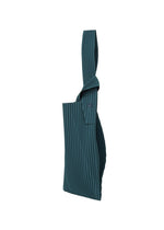 The UMBRELLA PLEATS BAG by HOMME PLISSÉ ISSEY MIYAKE is a teal, pleated fabric tote with a single wide strap, shown upright against a white background, and features an integrated umbrella holder for added convenience.