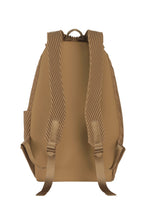 The PLEATS BACKPACK by HOMME PLISSÉ ISSEY MIYAKE in tan is shown from the back, featuring padded ribbed straps, a top handle, and a minimalist design without visible logos or extra pockets.