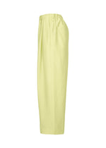The OPACITY pants by HOMME PLISSÉ ISSEY MIYAKE are light yellow, high-waisted, loose-fitting wide-leg trousers featuring an elastic waistband and straight legs, crafted from a soft linen blend and displayed from the side against a white background.