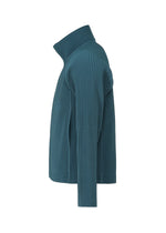 A teal, ribbed, long-sleeve raglan jacket is shown from the side. The jacket features a high collar and a textured, vertical stripe pattern throughout the fabric, accentuated by subtle diagonal pleats for added visual interest.