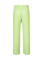 The MONTHLY COLORS : JULY pleated straight pants by HOMME PLISSÉ ISSEY MIYAKE, in light green quick-drying polyester with an elastic waistband, are shown on a plain white background.