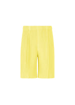MONTHLY COLORS : AUGUST by HOMME PLISSÉ ISSEY MIYAKE—yellow pleated lightweight shorts with an elastic waistband, crafted from quick-drying polyester and shown against a plain white background. - SHINE YELLOW （no.50）