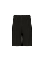 The “MONTHLY COLORS : AUGUST” shorts by HOMME PLISSÉ ISSEY MIYAKE are black, pleated, and knee-length with an elastic waistband, displayed against a plain white background. Made from quick-drying polyester, these lightweight shorts showcase a vertical striped texture.