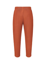 MONTHLY COLORS : AUGUST pants by HOMME PLISSÉ ISSEY MIYAKE feature an orange ribbed design with an elastic waistband and straight, cropped legs for lightweight comfort, showcased against a plain white background.