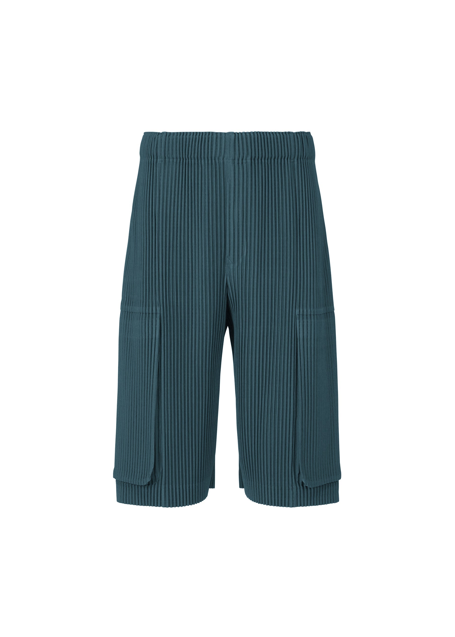 Zoomed view MONTHLY COLORS : SEPTEMBER shorts by HOMME PLISSÉ ISSEY MIYAKE are teal, pleated polyester shorts featuring an elastic waistband and large rectangular flap pockets on each side. These quick-drying shorts are shown on a plain white background. - SHADOW BLUE （no.76）