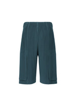 MONTHLY COLORS : SEPTEMBER shorts by HOMME PLISSÉ ISSEY MIYAKE in teal, featuring ribbed, quick-drying fabric, an elastic waistband, and two large front pockets, displayed against a white background.