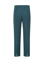 The TAILORED PLEATS 1 pants by HOMME PLISSÉ ISSEY MIYAKE feature a teal hue, straight-leg cut, elastic waistband, center-pressed pleats, and subtle front hem slits. Crafted from quick-drying polyester, they offer comfort and style for all-day wear.