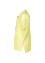 The LACE GRID PLEATS shirt by HOMME PLISSÉ ISSEY MIYAKE is a light yellow, short-sleeve open-collar top featuring a lace-like, semi-transparent plaid texture, displayed from the side against a white background.