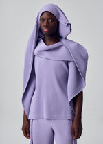 A person wears the HOMME PLISSÉ ISSEY MIYAKE MOTION BLUR set—a ribbed lavender outfit with matching pants and a pleated jersey top featuring a versatile draped hood—posed against a plain light background.