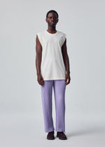 A person stands facing forward against a plain light gray background, wearing the HARD TWIST JERSEY sleeveless round-neck white top and light purple pleated pants by HOMME PLISSÉ ISSEY MIYAKE, paired with dark shoes.