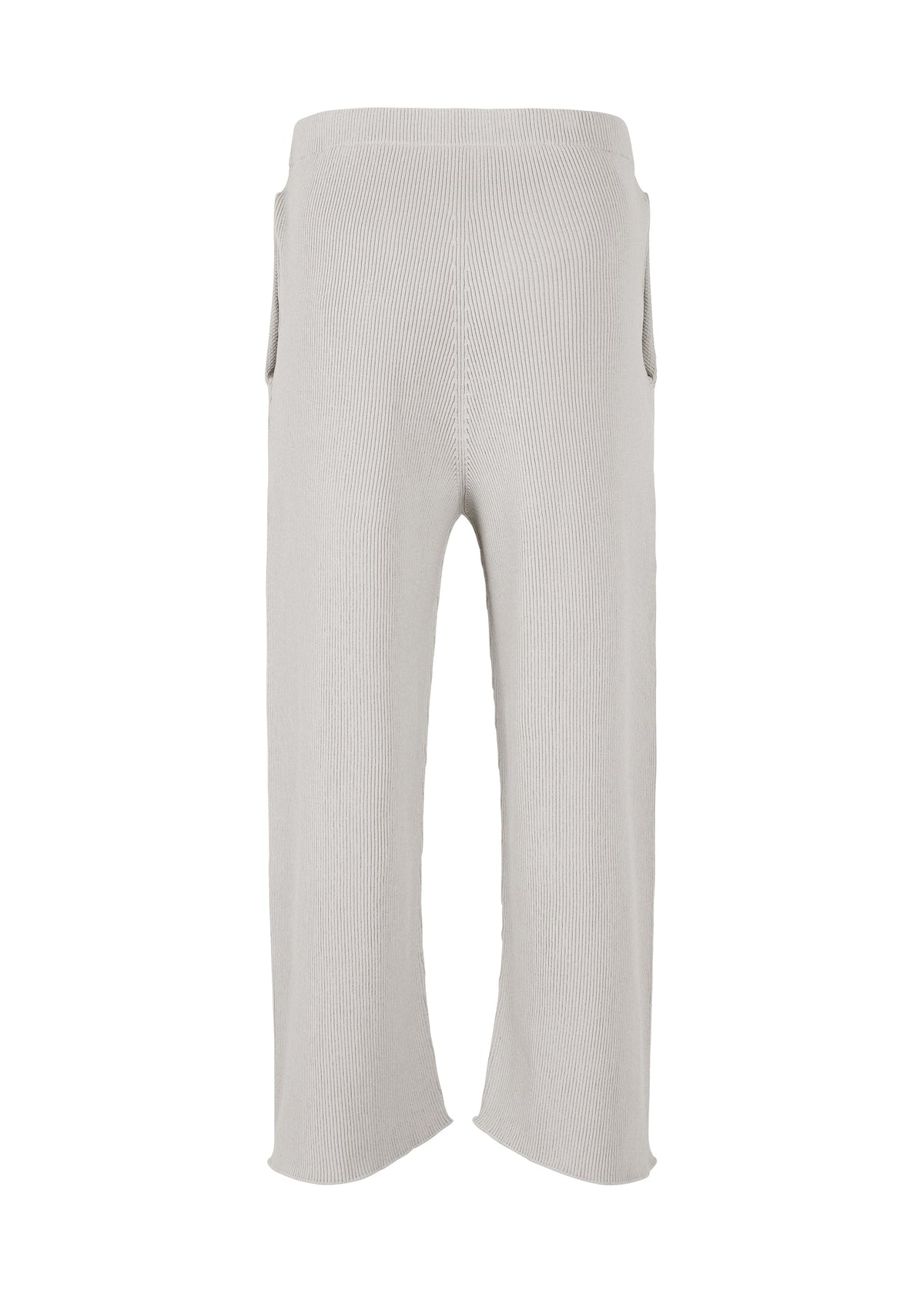 The BASIC KNIT pants by HOMME PLISSÉ ISSEY MIYAKE are light gray, ribbed knitwear trousers featuring a wide leg, cropped length, and high waist. Made from regenerated thread, they have an elastic waistband and provide a relaxed, comfortable fit. view 3 of 6