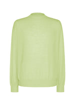 The KNIT UNRAVELED top by HOMME PLISSÉ ISSEY MIYAKE features a light green hue and long sleeves, with ribbed cuffs, waistband, and collar. This crewneck knit is perfect for layering and is shown against a plain white background. - GREEN （no.62）