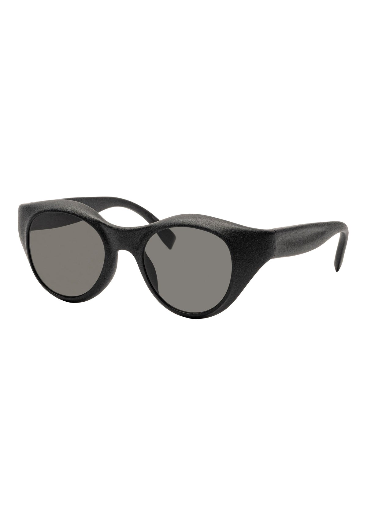 ISSEY MIYAKE EYES GRIT-BOSTON sunglasses feature thick, matte black Boston-style frames and dark tinted lenses, displayed at a slight angle on a white background. view 1 of 6