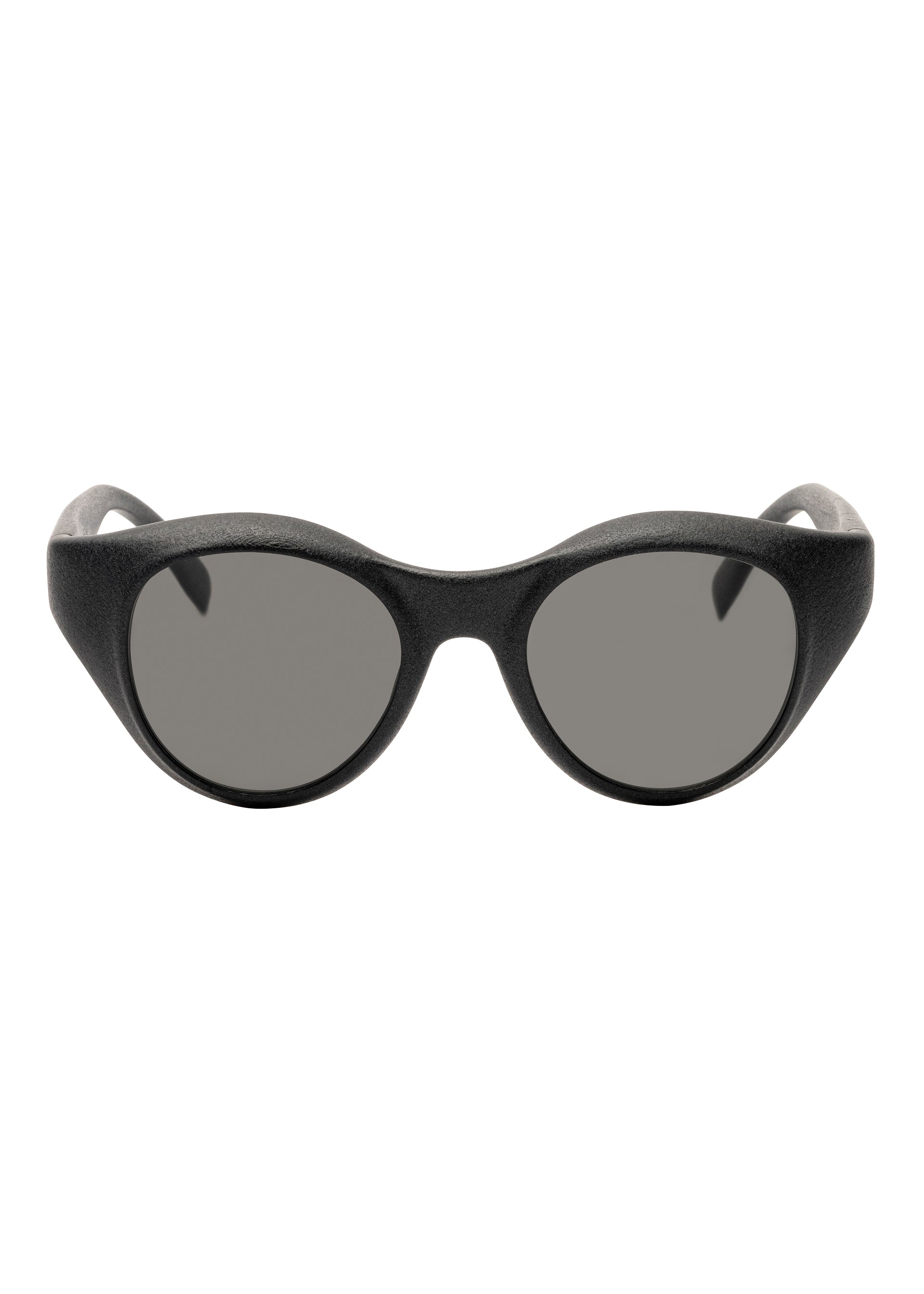 Zoomed view Front view of ISSEY MIYAKE EYES GRIT-BOSTON black Boston-style oval sunglasses with thick, rounded frames and dark tinted lenses against a white background.