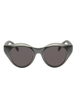 Front view of ISSEY MIYAKE EYES GRIT-BOSTON black Boston-style sunglasses featuring thick, shiny oval frames and dark tinted lenses, displayed on a white background.