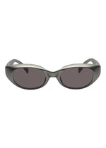 Front view of GRIT-SQUARE oval-shaped sunglasses by ISSEY MIYAKE EYES, featuring matte gray 3D printed thick plastic frames and dark tinted lenses.