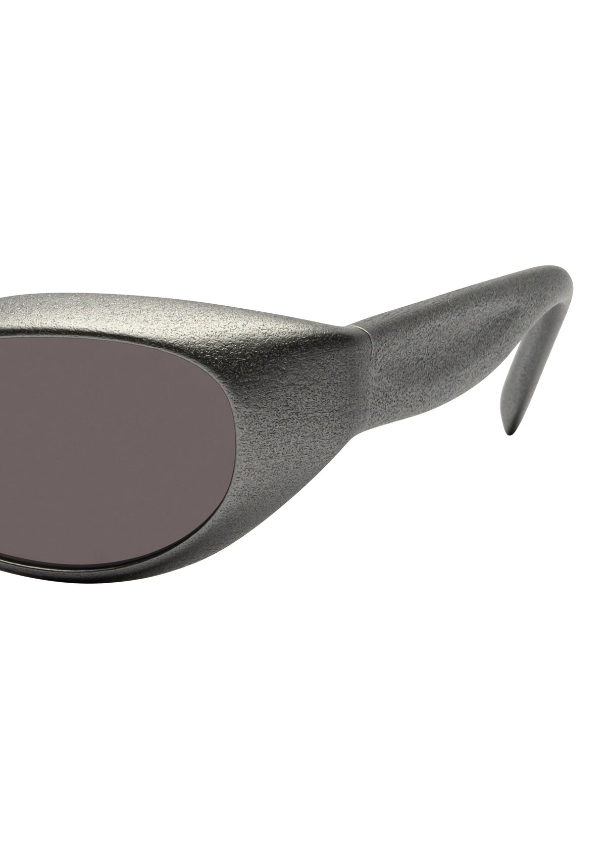 Close-up of the side of ISSEY MIYAKE EYES GRIT-SQUARE 3D printed sunglasses, featuring a textured metallic gray frame, dark oval lenses, and a thick arm. view 4 of 5