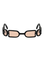 ISSEY MIYAKE EYES UROKO sunglasses, with distinctive rectangular shapes, black frames, and light pink lenses, highlight Japanese craftsmanship from the front view against a white background.