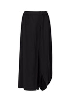 The SEAMLESS BOTTOMS by 132 5. ISSEY MIYAKE are black asymmetrical wide-leg pants with a draped, wrap-style front, elastic waistband, button closure, and belt loops—made from recycled polyester for comfort and sustainable style. - Black (no. 15)