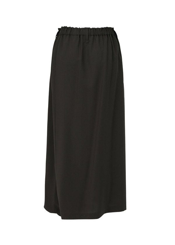 The SEAMLESS BOTTOMS by 132 5. ISSEY MIYAKE is a plain black midi skirt with an elastic waistband and relaxed silhouette, designed for comfort, shown against a white background. view 3 of 11
