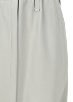 Close-up of light gray polyester fabric on the JERSEY BOTTOMS BASIC by 132 5. ISSEY MIYAKE, showing a waistband, belt loop, and vertical seam—details typical of this garment.