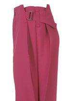 VERTEX BOTTOMS by 132 5. ISSEY MIYAKE: Magenta high-waisted pants with side buckle, pleated waist, and straight leg silhouette, shown in profile against a white background.