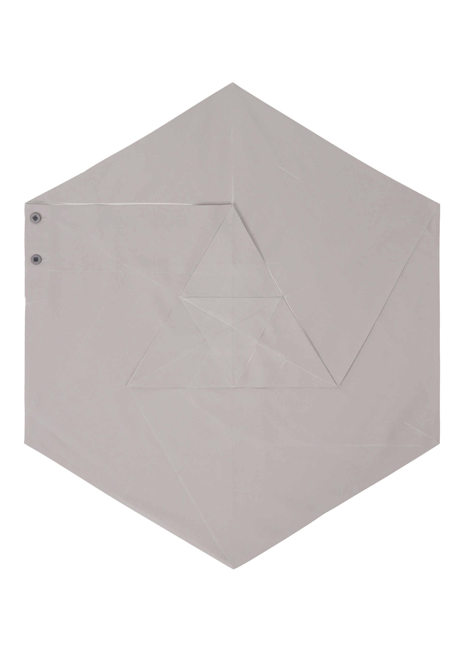 Zoomed view The NO.17 PRINT skirt by 132 5. ISSEY MIYAKE features a gray, hexagonal fabric folded with precise geometric lines, accented by side snaps and an origami-inspired layered design that highlights its innovative structure.
