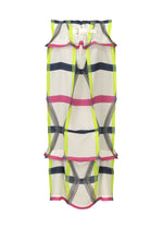 The NO.6 TRANSLUCENT by 132 5. ISSEY MIYAKE is a sheer skirt with a bold yellow, pink, and black checkered pattern, ruffled edges, fold structure, and a white waistband with buckle; petticoat included for comfort and style.