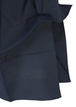 A close-up of navy blue NO.6 SOLID fabric by 132 5. ISSEY MIYAKE, showing its smooth, slightly shiny texture with visible seams and folds—highlighting its three-dimensional drape.