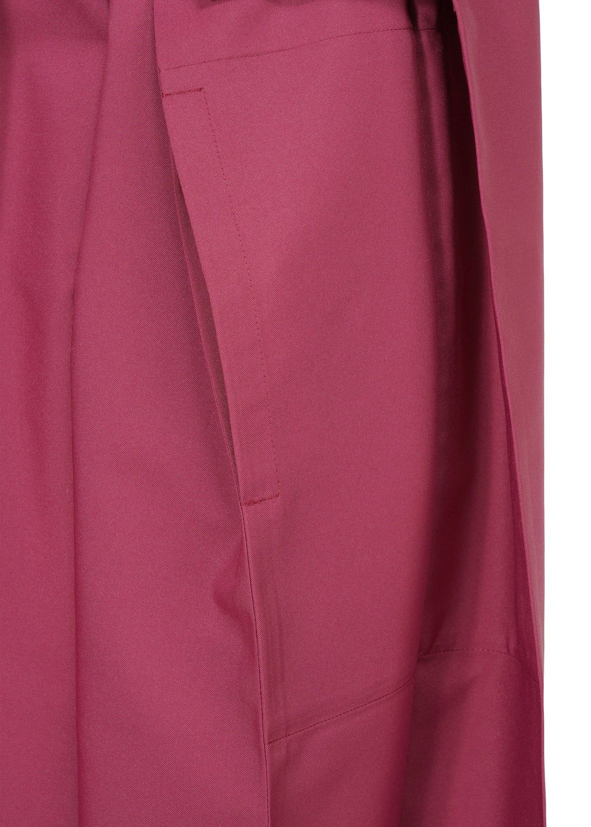 Close-up of the 132 5. FLAT 1 by 132 5. ISSEY MIYAKE in magenta, featuring a pocket and visible stitching that highlights its unique structure. view 5 of 10