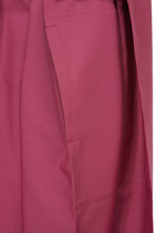 Close-up of the 132 5. FLAT 1 by 132 5. ISSEY MIYAKE in magenta, featuring a pocket and visible stitching that highlights its unique structure.