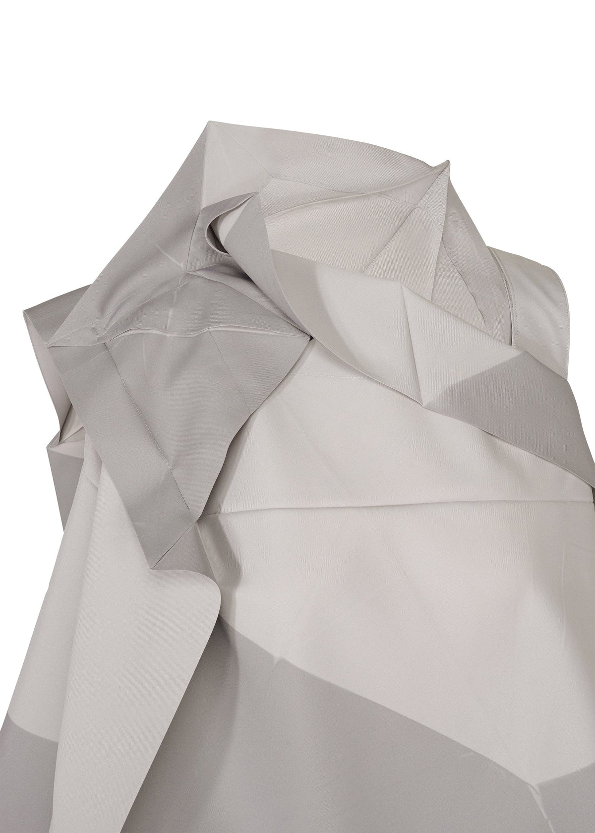 A close-up of light gray and white folded fabric from the NO.17 PRINT by 132 5. ISSEY MIYAKE, featuring sharp geometric patterns that echo the distinctive folding structure for a textured, abstract look inspired by innovative wearable design. view 5 of 11