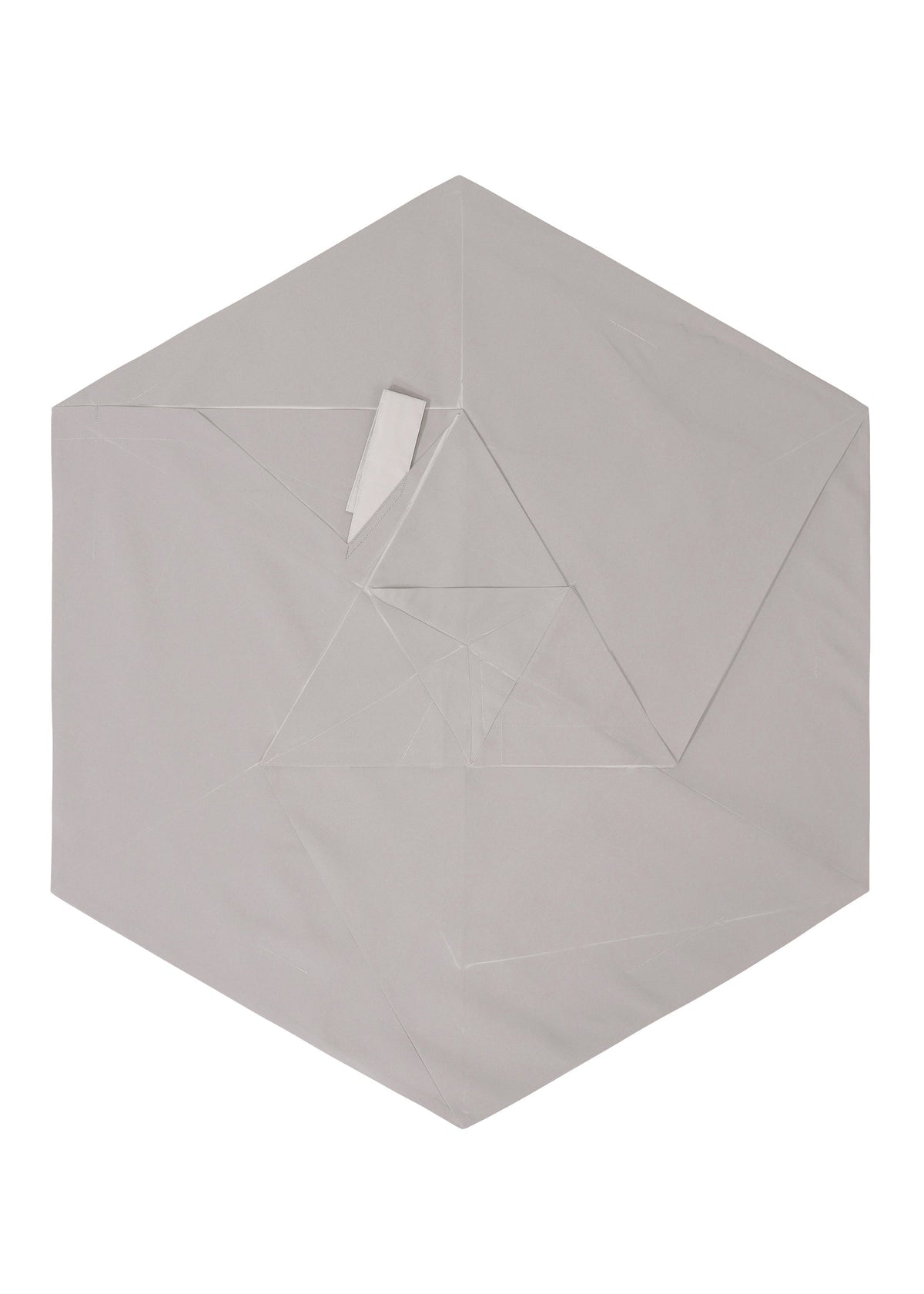 The NO.17 PRINT by 132 5. ISSEY MIYAKE is a light gray, hexagon-shaped origami paper with visible folds and layers, forming geometric patterns on a white background and echoing the No. 17 folding structure. view 6 of 11