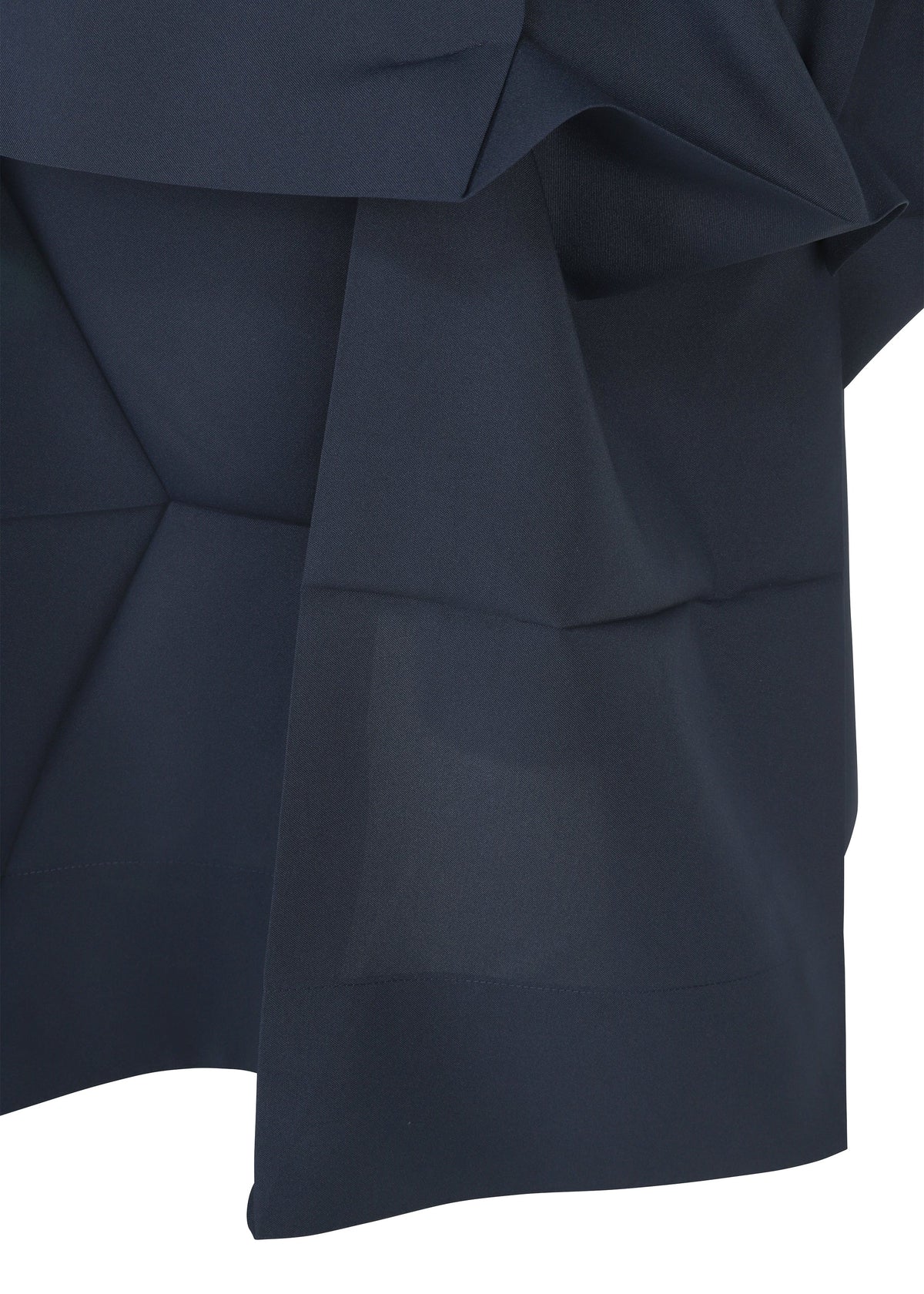 A close-up of dark navy NO.6 SOLID fabric by 132 5. ISSEY MIYAKE, featuring angular folds and layers that highlight its three-dimensional, structured geometric design. view 3 of 9