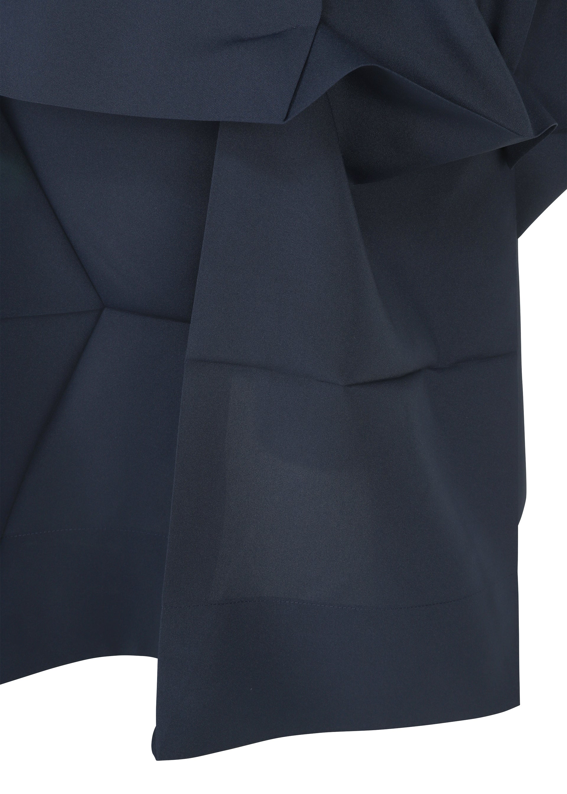 Zoomed view A close-up of dark navy NO.6 SOLID fabric by 132 5. ISSEY MIYAKE, featuring angular folds and layers that highlight its three-dimensional, structured geometric design.