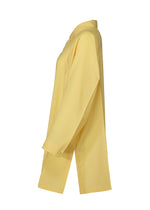The FOLD SHIRT by 132 5. ISSEY MIYAKE is a light yellow, long-sleeve button-up with a pointed collar, relaxed fit, and subtle folding structure for added style, shown from the side.
