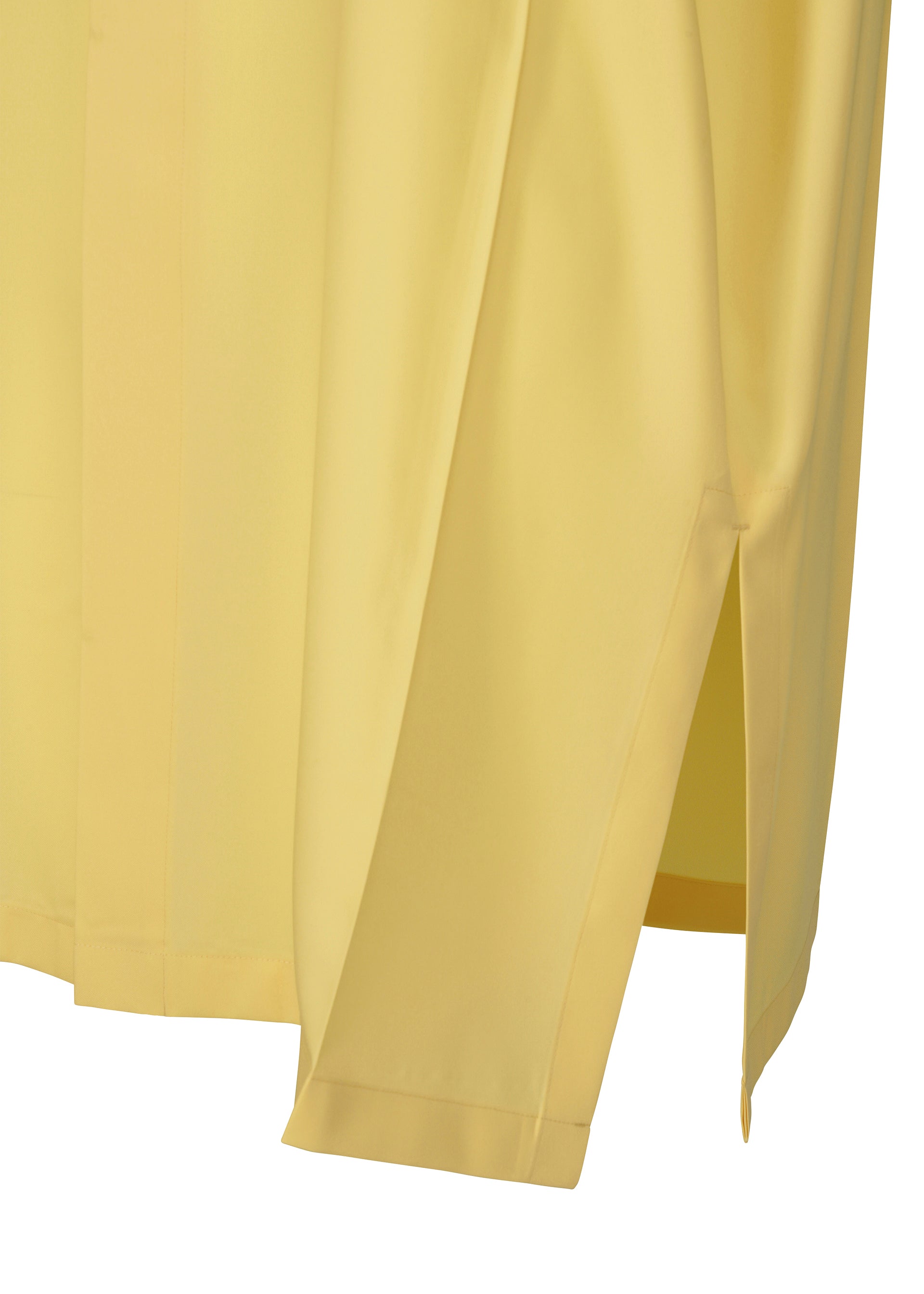 Zoomed view A close-up of the lower part of the FOLD SHIRT by 132 5. ISSEY MIYAKE, light yellow with a regular collar, showcasing the side seam, sleeve, and bottom hem featuring a side slit and subtle folding details.