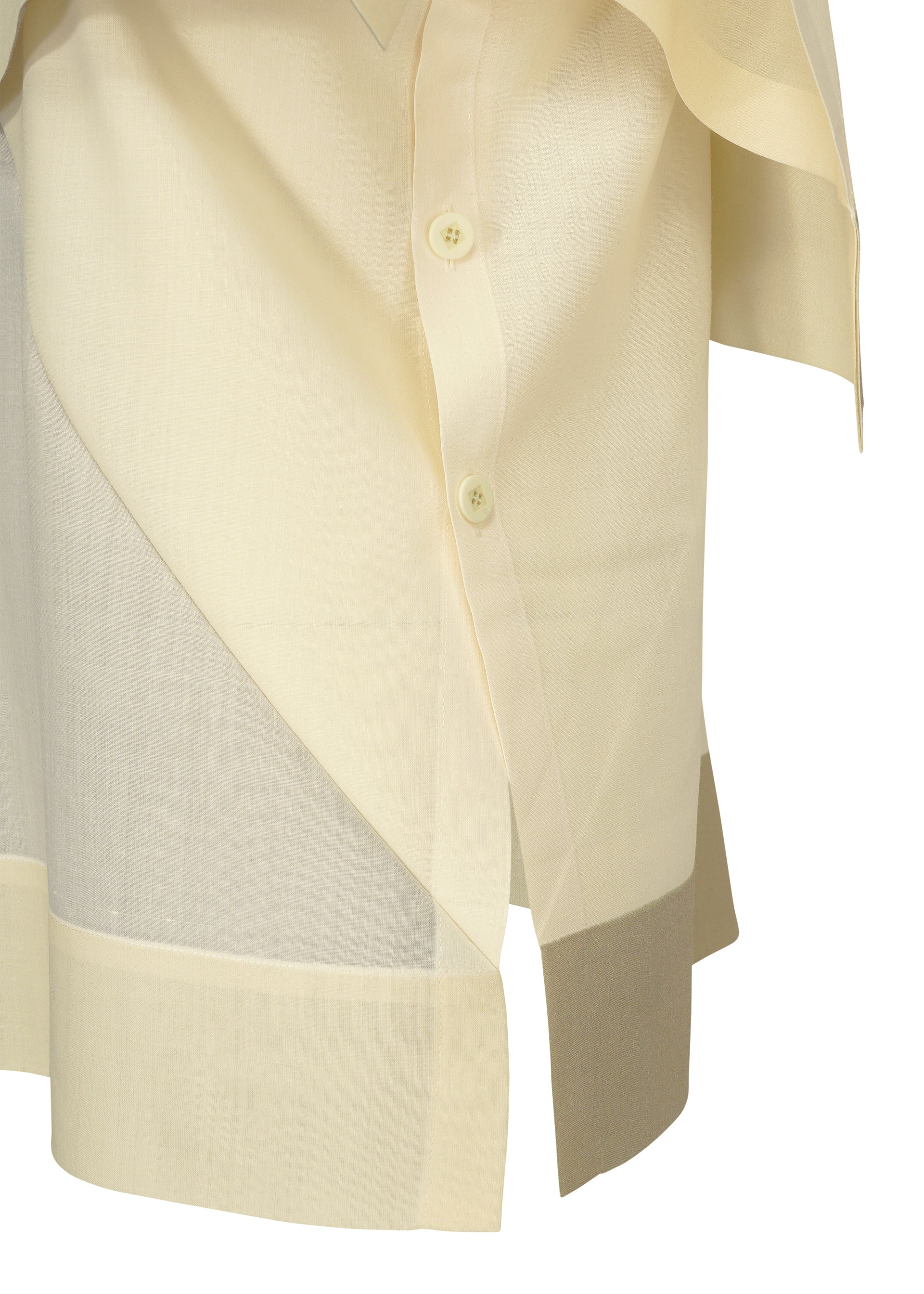 Zoomed view A close-up of the FOLD RAMIE PRINT shirt by 132 5. ISSEY MIYAKE shows its light beige semi-sheer fabric, front buttons, asymmetrical overlapping panels, contrasting hems, and subtle transfer print detail.