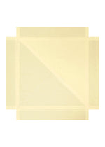 FOLD RAMIE PRINT by 132 5. ISSEY MIYAKE is a large, flat, pale yellow sheet with creases forming geometric patterns and subtle colorful designs, reminiscent of a delicate transfer print, set on a white background.