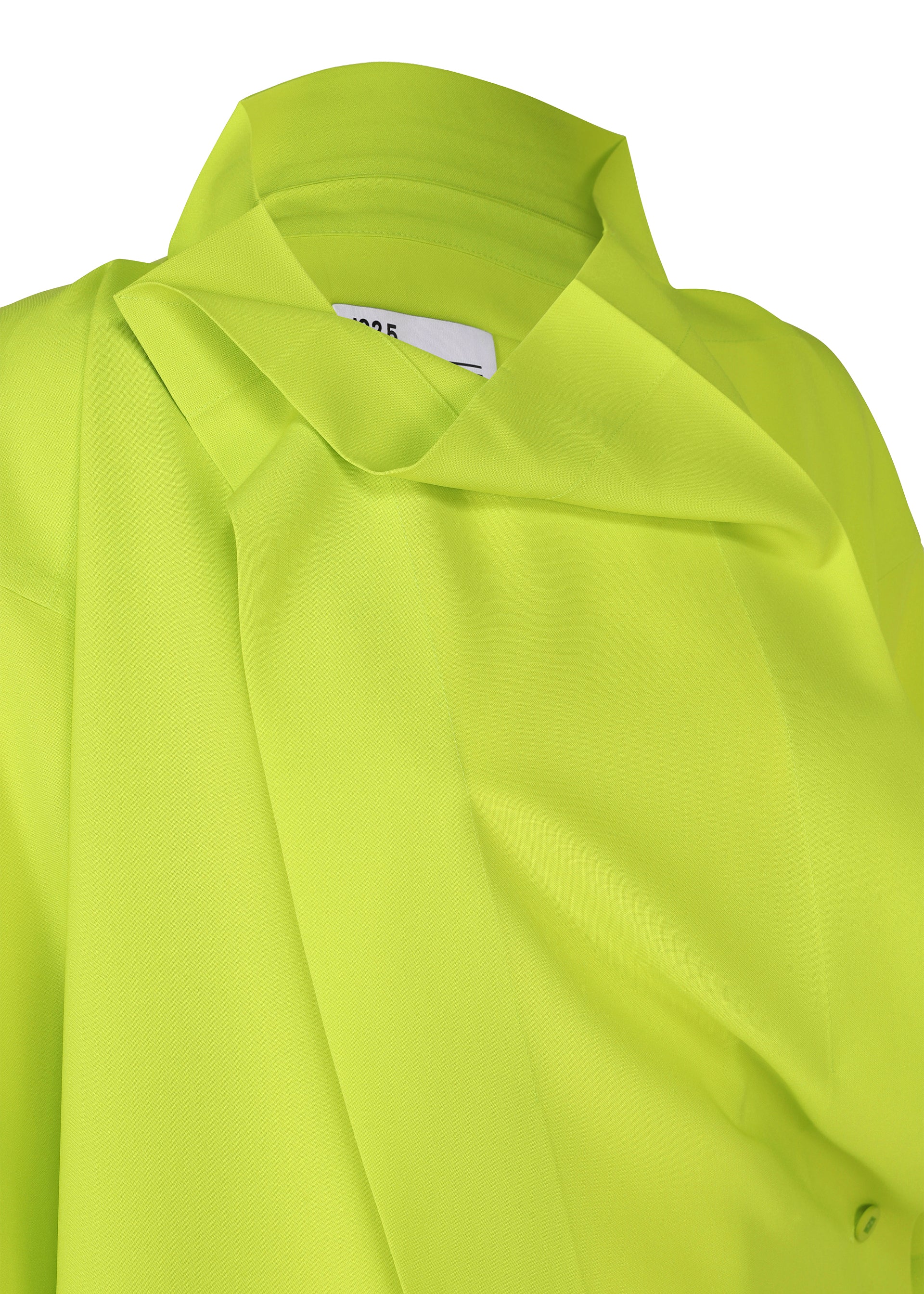 Zoomed view A close-up of the FLAT TUCK T by 132 5. ISSEY MIYAKE, a neon yellow-green collared top with a modern, structured design and smooth fabric. A partially visible white label is sewn inside the collar.