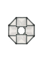 A top-down view of the NO.6 TRANSLUCENT by 132 5. ISSEY MIYAKE: a geometric octagonal mesh frame with black borders, a central square, and an open square hole, echoing fold structures in sheer fabric against a white background.