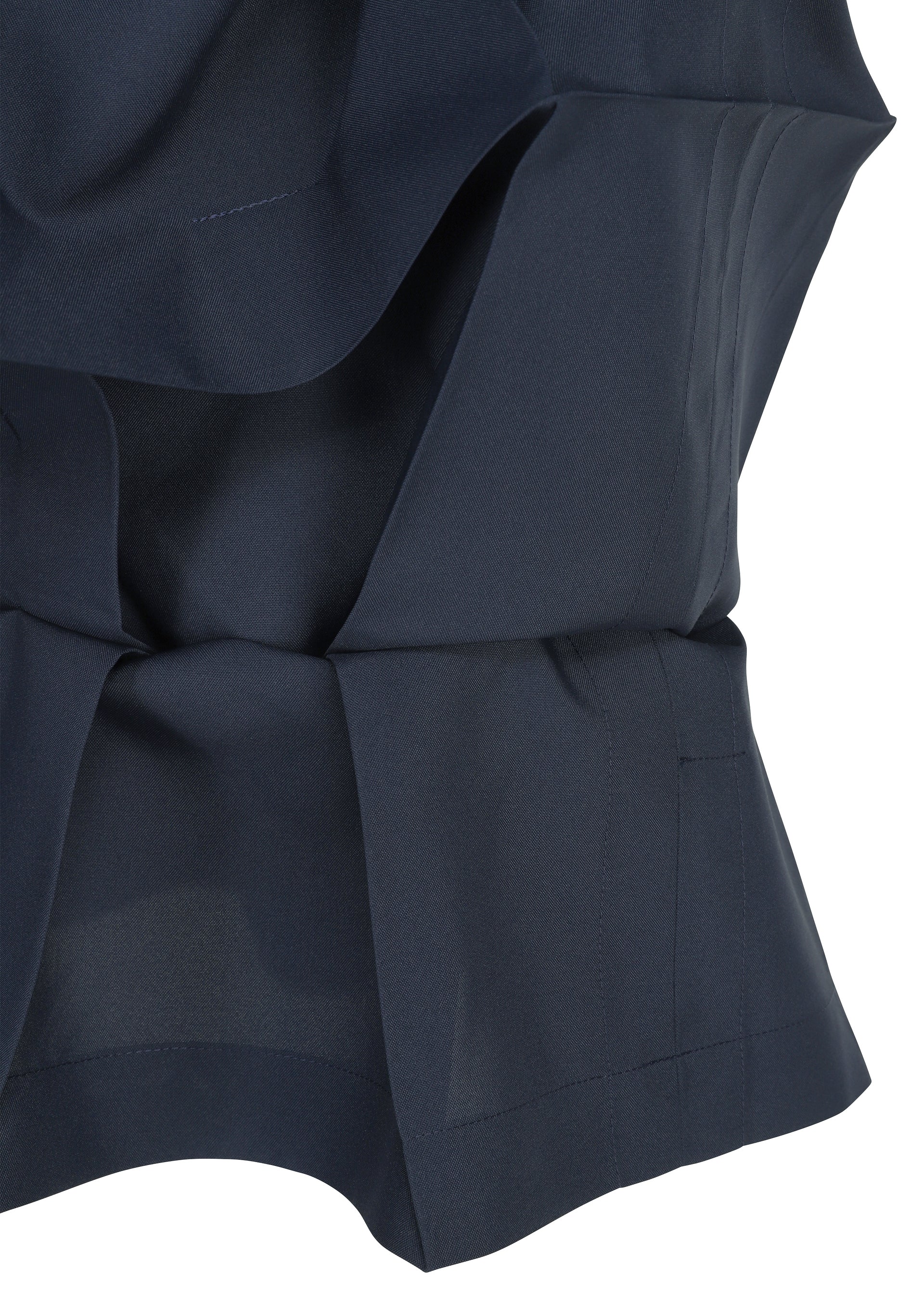 Zoomed view Close-up of the NO.6 SOLID by 132 5. ISSEY MIYAKE in navy, showcasing its crisp three-dimensional form with layered folds, clean seams, and precise tailored details.
