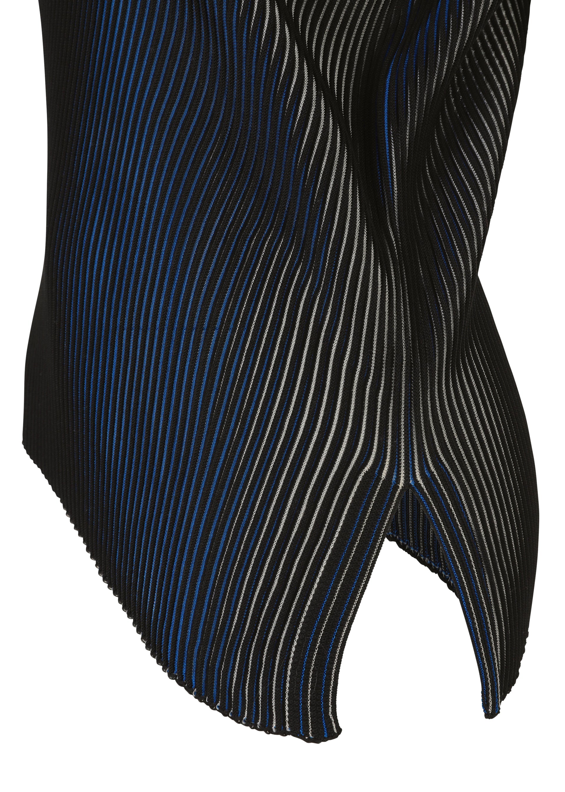 Zoomed view Close-up of FACET KNIT by 132 5. ISSEY MIYAKE: pleated black fabric with thin, diagonal blue and white stripes, wavy texture, curved notched edge, and striking pattern depth from a unique knitting structure.
