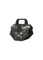 The 132 5. STANDARD BAG by 132 5. ISSEY MIYAKE is a geometric black handbag with angular handles, featuring silver and gray abstract patterns on the front; crafted from recycled polyester, it blends modern style with sustainable design. - BLACK×SILVER (no.91)