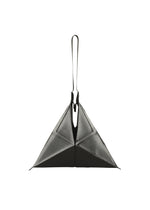 The F-BG by 132 5. ISSEY MIYAKE is a black, geometric, pyramid-shaped bag crafted from recycled polyester, featuring a single loop handle at the top and shown against a white background.