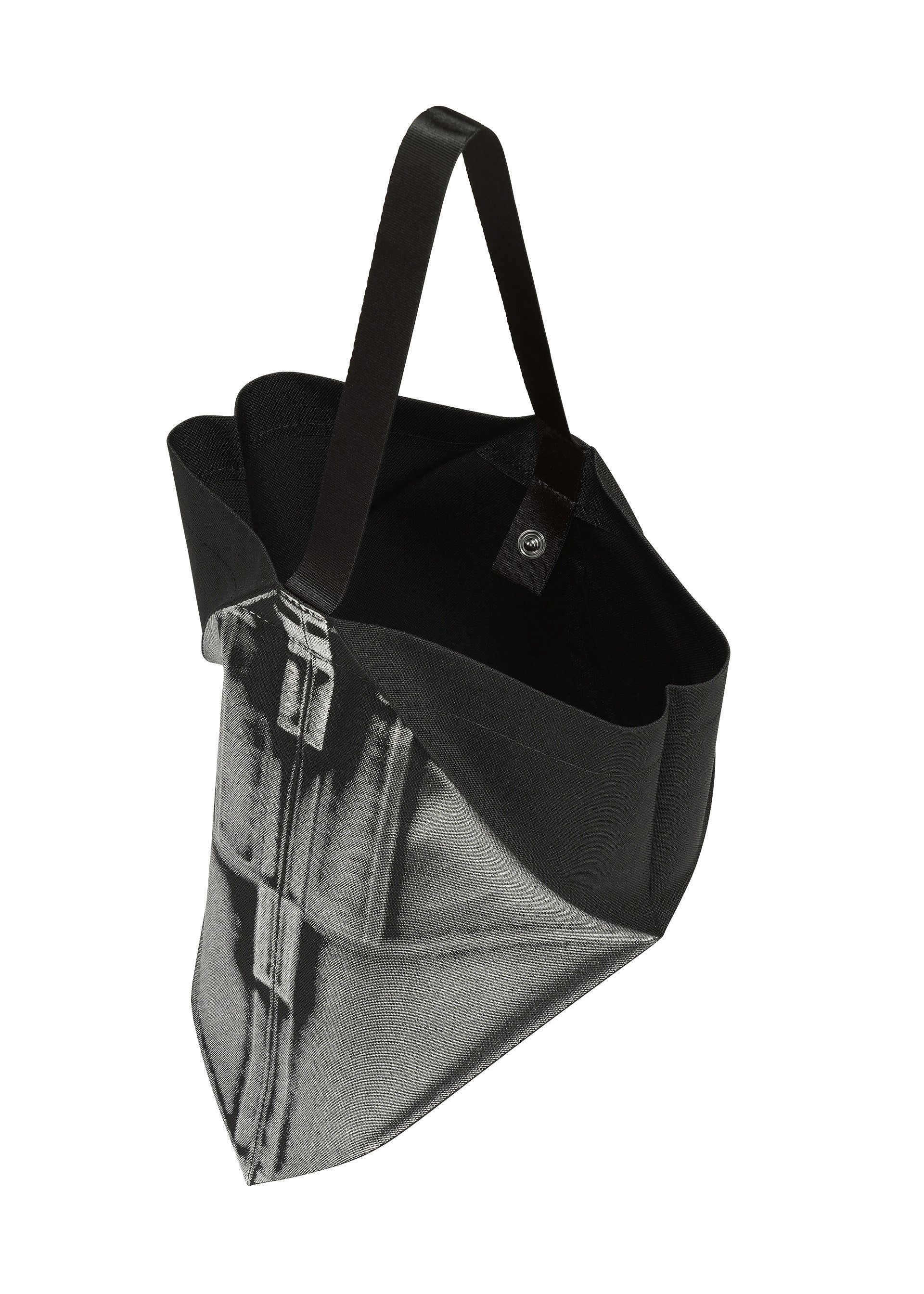 Zoomed view The F-BG tote bag by 132 5. ISSEY MIYAKE is made from recycled polyester in black, showcasing a photographic denim jeans print, black handles, and an open top—presented from an angled overhead perspective.